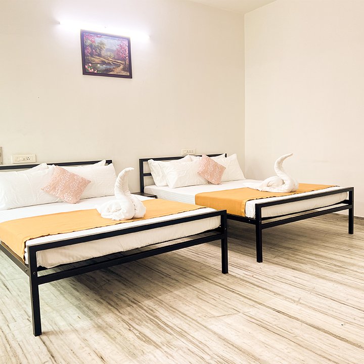 Spacious bedroom with two queen beds at Vasantha’s Home Stay by Le Hotel Host in Thillainagar, Trichy